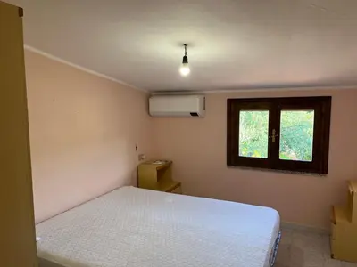 Letto o letti in una camera di Casa Vacanze Cugusi