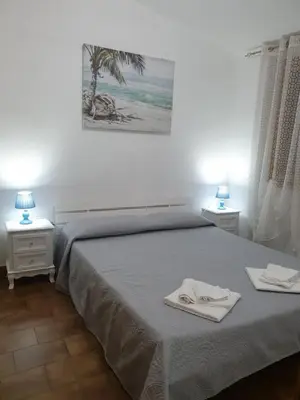 Letto o letti in una camera di Casa Luciano