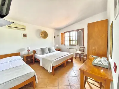 Letto o letti in una camera di Hotel Velasole