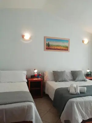 Letto o letti in una camera di Hotel Velasole