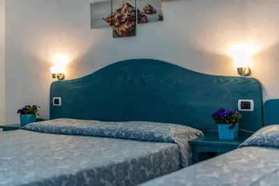 Letto o letti in una camera di Hotel Quasar