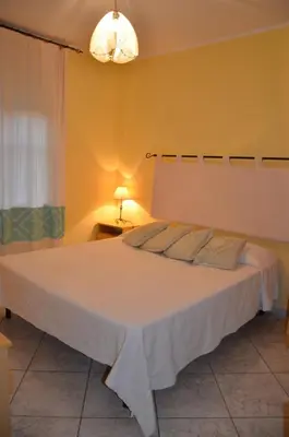 Letto o letti in una camera di Vacanze Sardegna Mare San Giovanni Posada