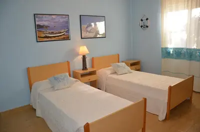 Letto o letti in una camera di Vacanze Sardegna Mare San Giovanni Posada