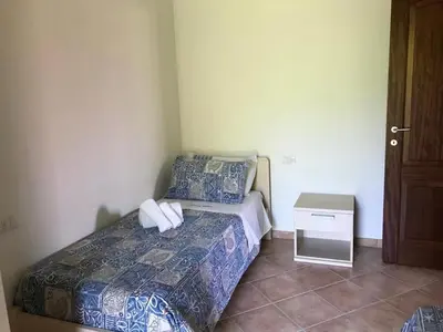 Letto o letti in una camera di Residence Arruli