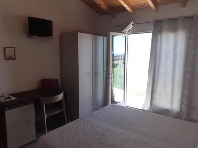 Letto o letti in una camera di sole e sale 2