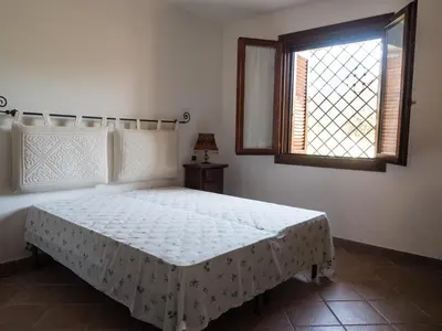 Letto o letti in una camera di Residence degli ulivi
