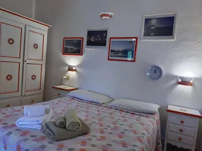 Letto o letti in una camera di B&B La Taerra