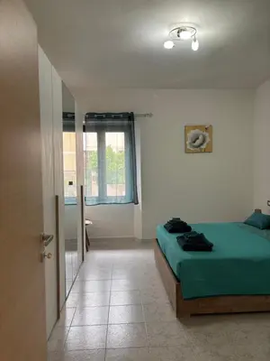 Letto o letti in una camera di Appartamenti accoglienti nel cuore di Siniscola