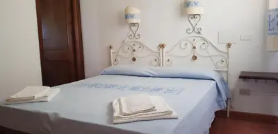 Letto o letti in una camera di Residence Spiaggia Bianca
