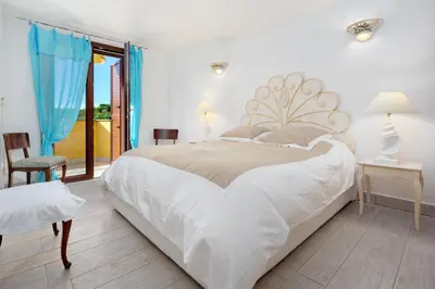 Letto o letti in una camera di Villa Baia Caddinas