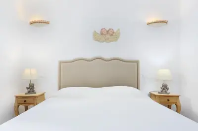Letto o letti in una camera di Villa Baia Caddinas
