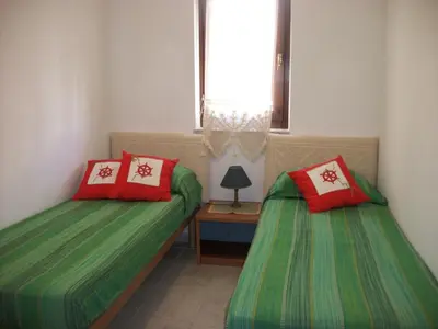 Letto o letti in una camera di Casa Tavolara