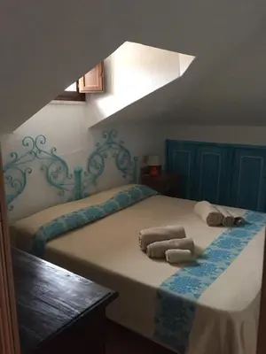 Letto o letti in una camera di Casa Gallo