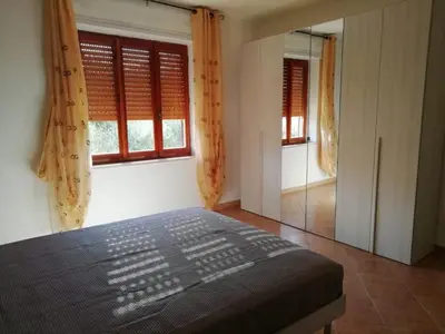 Letto o letti in una camera di Villa San Gavino