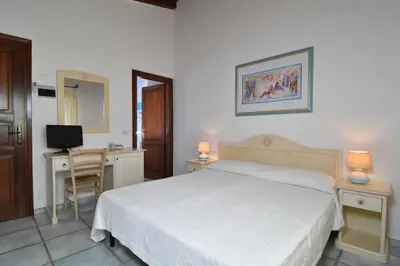Letto o letti in una camera di Li Suari Club Village