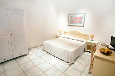 Letto o letti in una camera di Li Suari Club Village