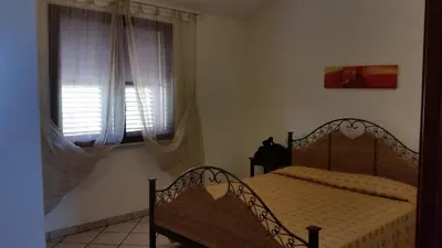 Letto o letti in una camera di casa Angy