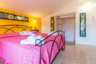 Letto o letti in una camera di Casa Vacanze Nonna Mariuccia