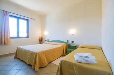 Letto o letti in una camera di Albergo Residenziale Gli Ontani
