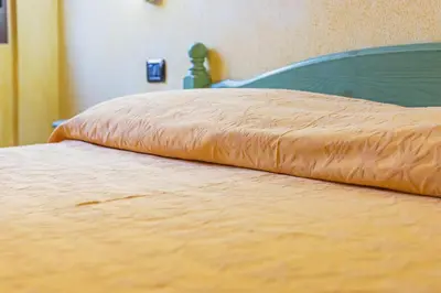 Letto o letti in una camera di Albergo Residenziale Gli Ontani