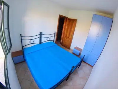 Letto o letti in una camera di Residence Edilmare San Teodoro