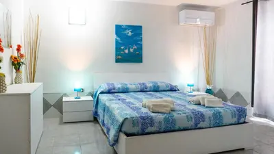 Letto o letti in una camera di Appartamento Cala Paradiso