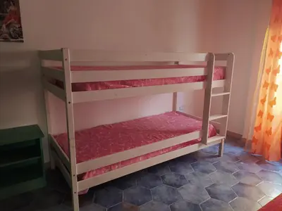 Letto o letti in una camera di appartamento Oleandro