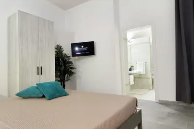 TV o dispositivi per l'intrattenimento presso Le Arcada - Appartamenti nel cuore del centro storico di Orosei