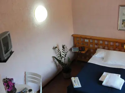 Letto o letti in una camera di Hotel Scintilla