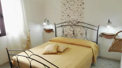 Letto o letti in una camera di Appartamenti Sardegna