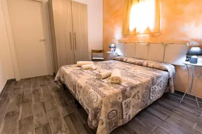 Letto o letti in una camera di Affittacamere L ' Oasi di Gino