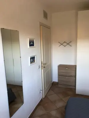 Letto o letti in una camera di Appartamento in residence fronte mare