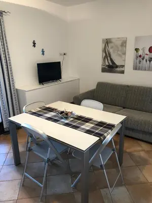 TV o dispositivi per l'intrattenimento presso Appartamento in residence fronte mare