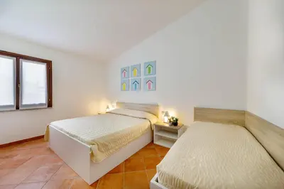 Letto o letti in una camera di Lu Maestrali Apartment