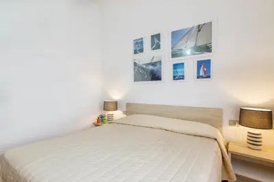 Letto o letti in una camera di Lu Maestrali Apartment