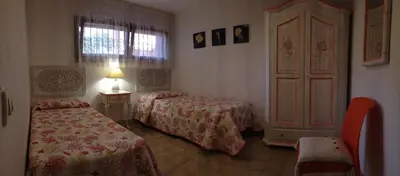 Letto o letti in una camera di Sardegna Beach Cala Reale