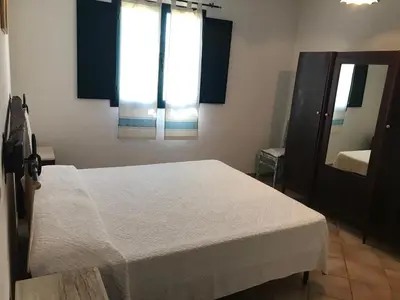 Letto o letti in una camera di Villa Sa Curcurica