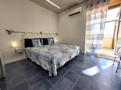 Letto o letti in una camera di Nughe 'e' Oro Guesthouse