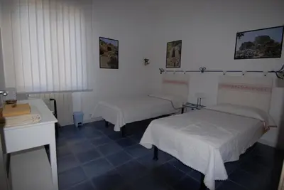 Letto o letti in una camera di Nughe 'e' Oro Guesthouse