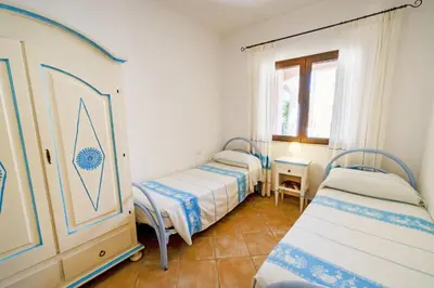 Letto o letti in una camera di Le Case di Maiorca CAV - PMS CaseVacanze