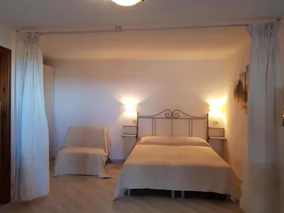Letto o letti in una camera di Lulamax Sardegna