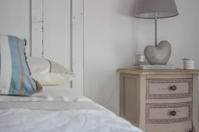 Letto o letti in una camera di villa Le farfalle
