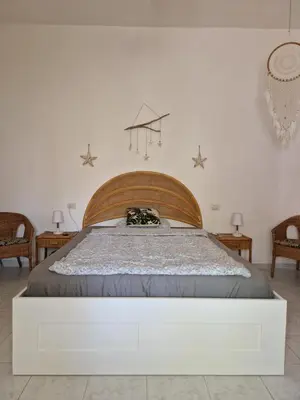 Letto o letti in una camera di Casa Aresula