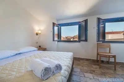 Letto o letti in una camera di Karama