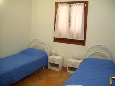 Letto o letti in una camera di VILLA A 200 METRI DALLA SPIAGGIA