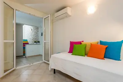 Letto o letti in una camera di Apartment in S'Abba e Sa Pedra complex with pool