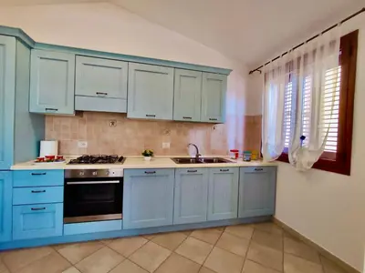 Cucina o angolo cottura di Appartamento La Caletta 500m dal mare