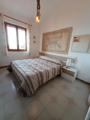 Letto o letti in una camera di casa luisa