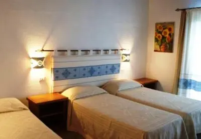 Letto o letti in una camera di B&B Sa Soliana