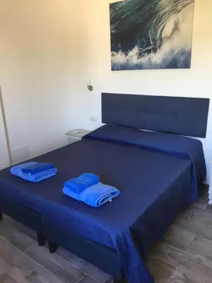 Letto o letti in una camera di Sardegna Mer et Soleil in Olbia